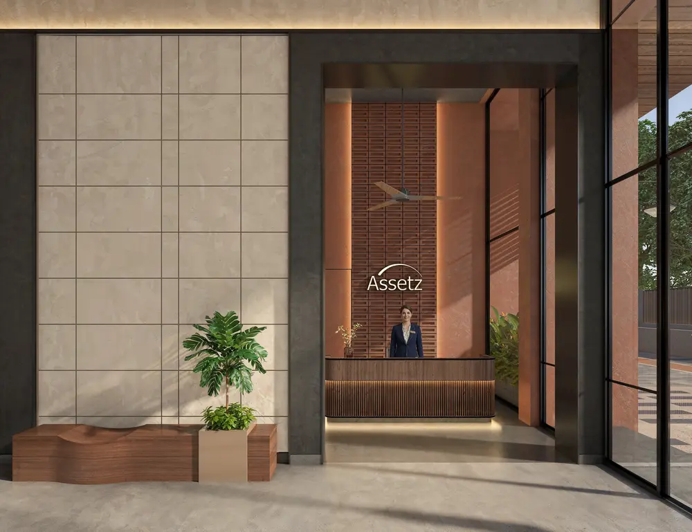 Single residential tower above a tree-lined street — Assetz Muse & Maison (5 of 6)