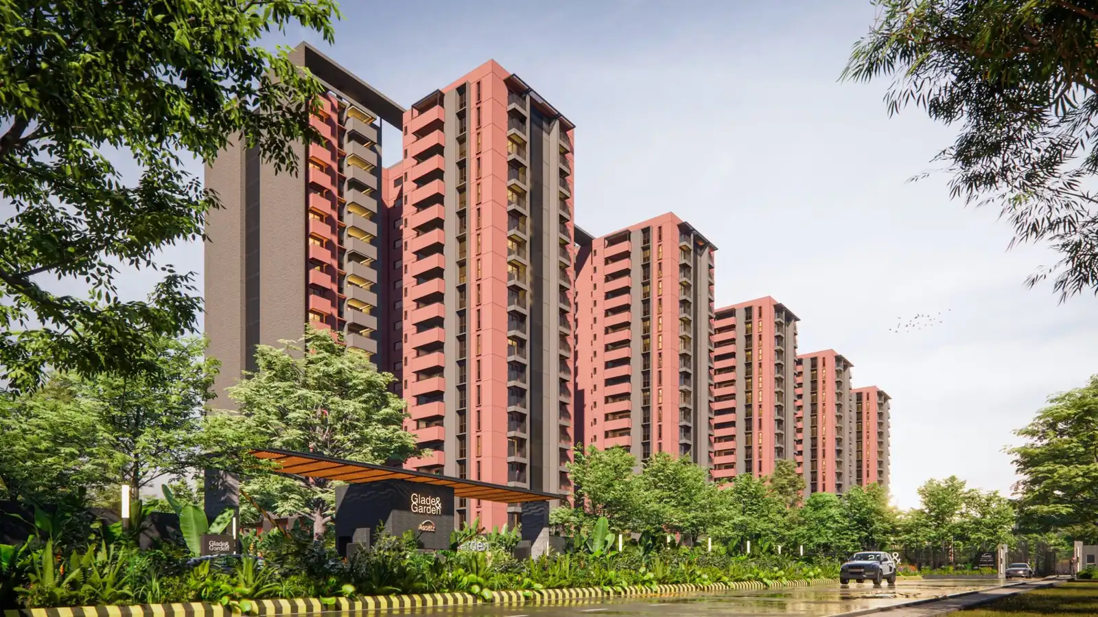 Terracotta towers behind a landscaped entrance — Assetz Sora & Saki (1 of 6)