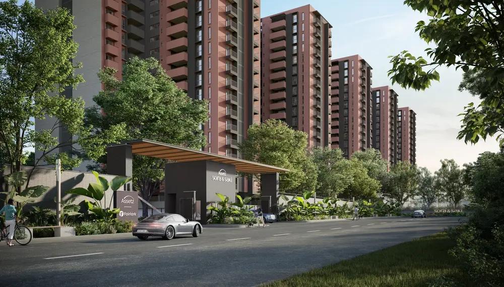 Terracotta towers behind a landscaped entrance — Assetz Sora & Saki (4 of 6)