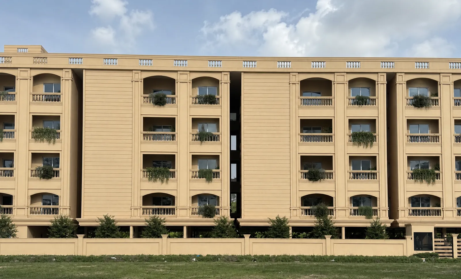 Boutique tower above a landscaped entrance