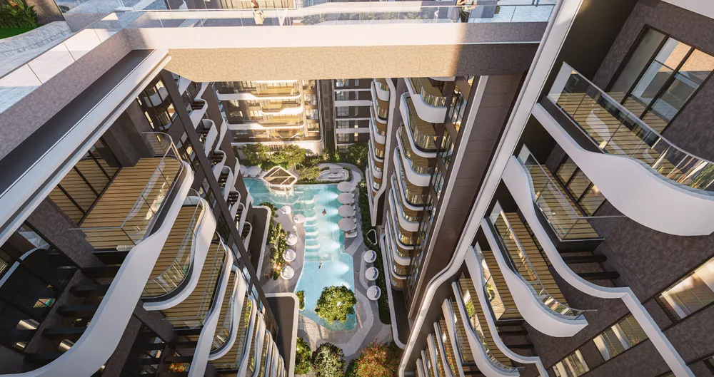 Residential towers rising over greenery — Brigade Stellaris (3 of 6)