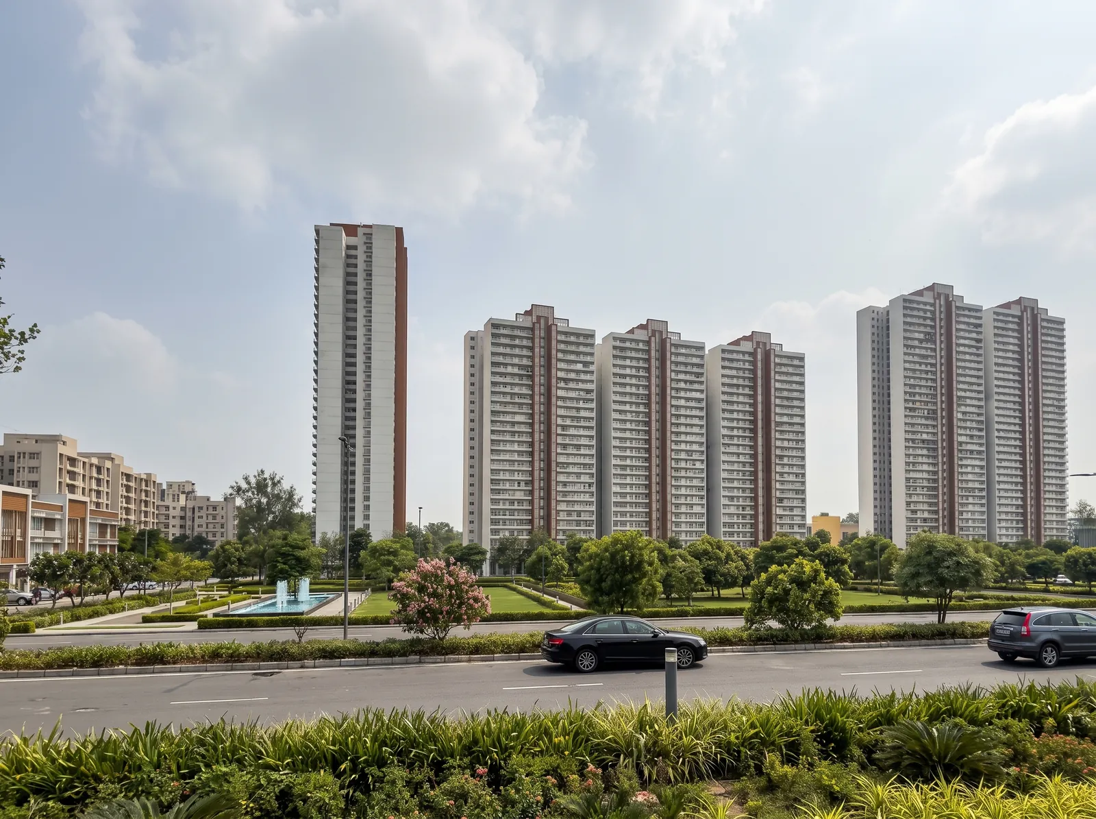 Landscaped residential towers amid greens