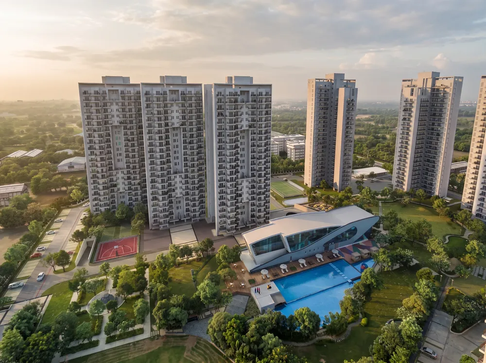 Twilight exterior with clubhouse pool — Godrej Crown (2 of 5)