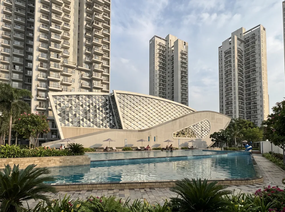 Twilight exterior with clubhouse pool — Godrej Crown (3 of 5)