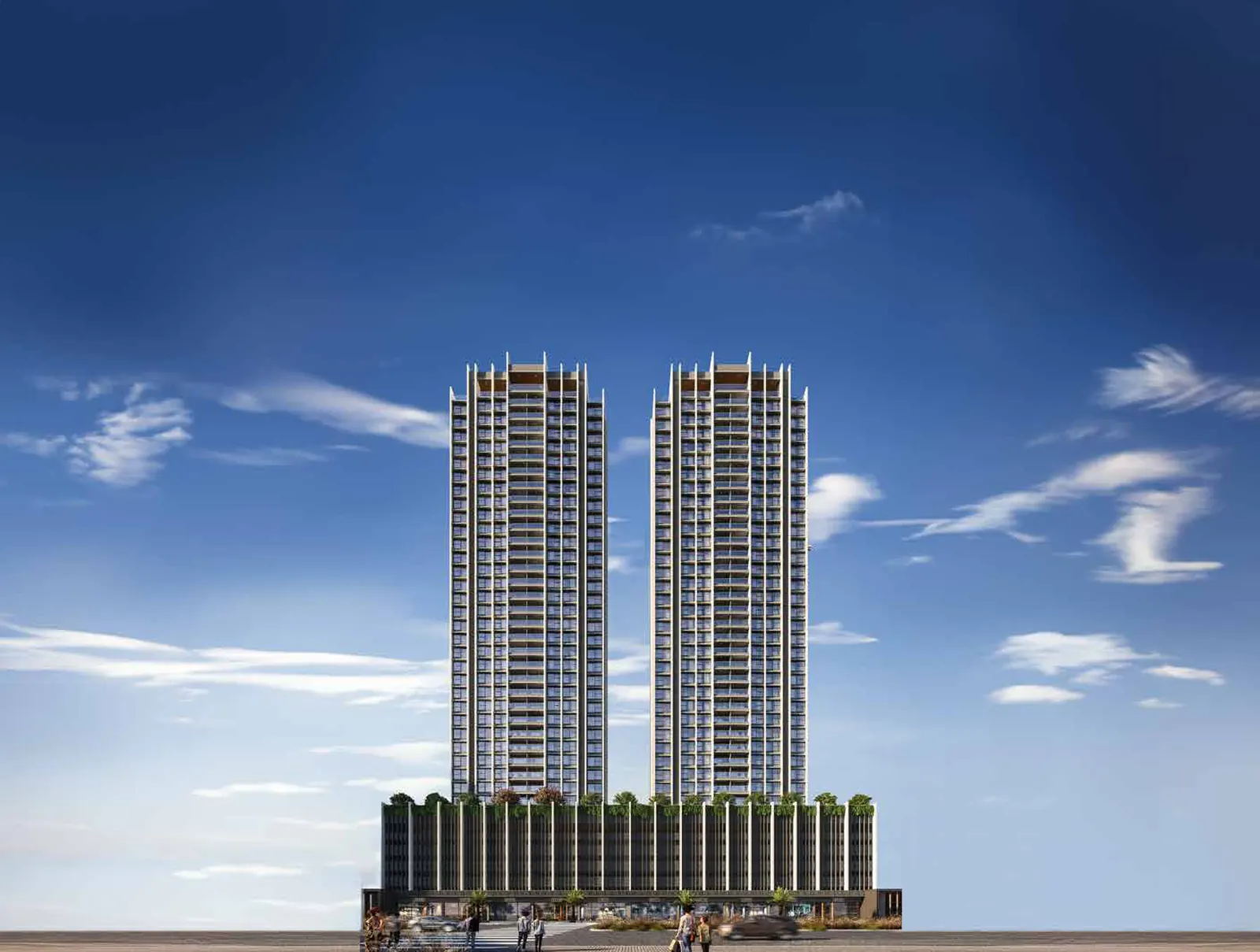 Twin towers above a landscaped podium under a blue sky