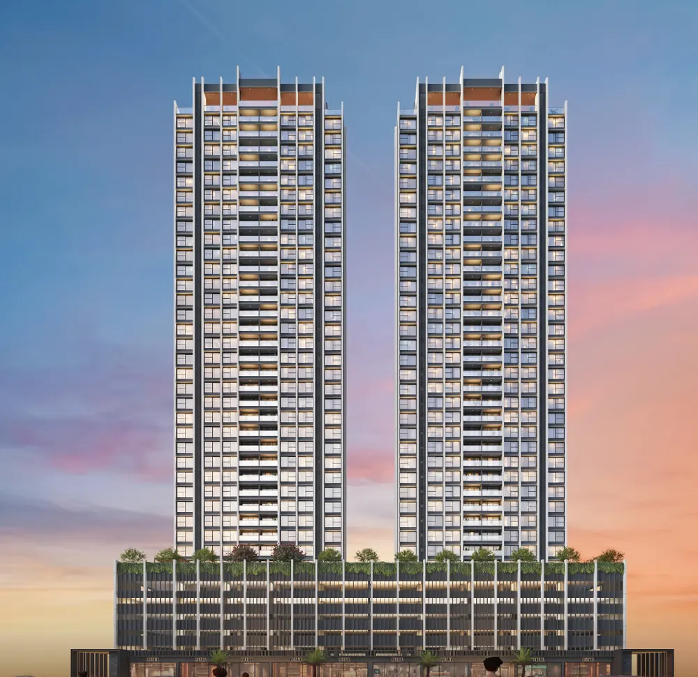 Twin towers above a landscaped podium under a blue sky — Godrej Eternal Palms (3 of 5)
