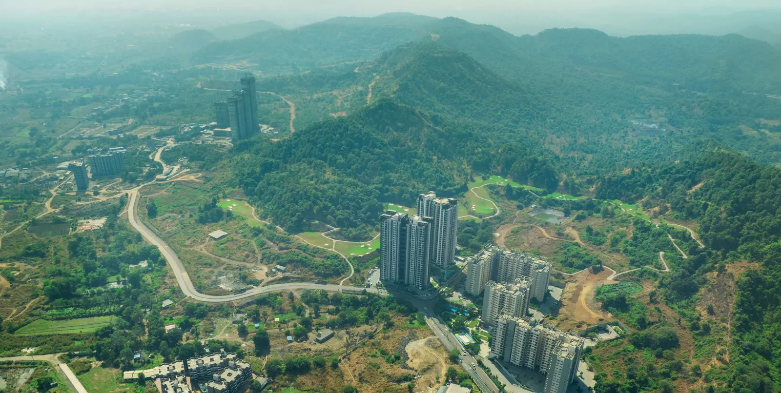 Aerial view of Godrej City towers among green hills — Golf Crest at Godrej City (1 of 4)