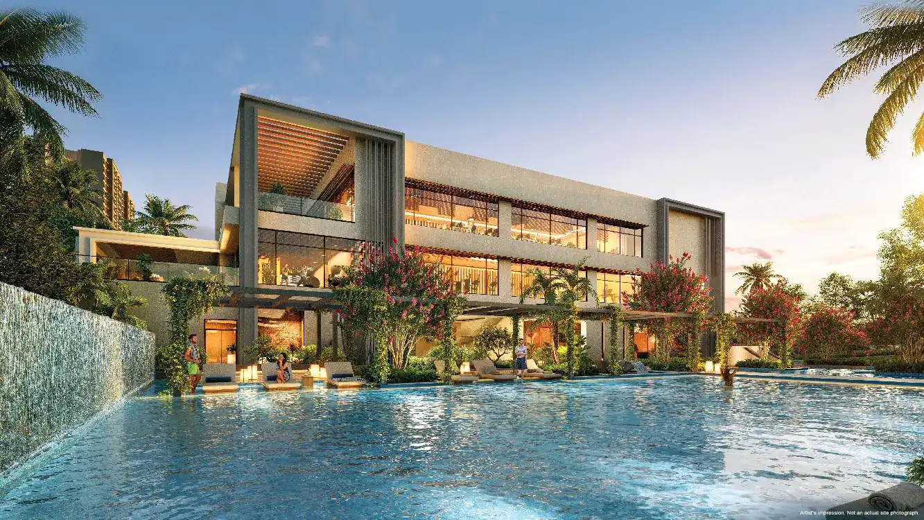 Clubhouse beside a pool at dusk