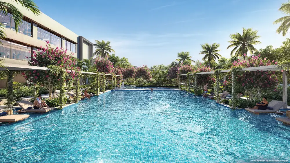 Clubhouse beside a pool at dusk — Godrej Lakeside Orchard (4 of 5)