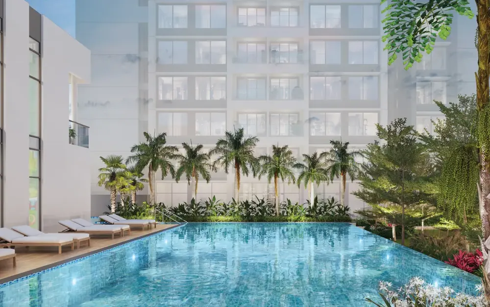 Three residential towers rising beside a city road — Godrej Nurture (3 of 6)