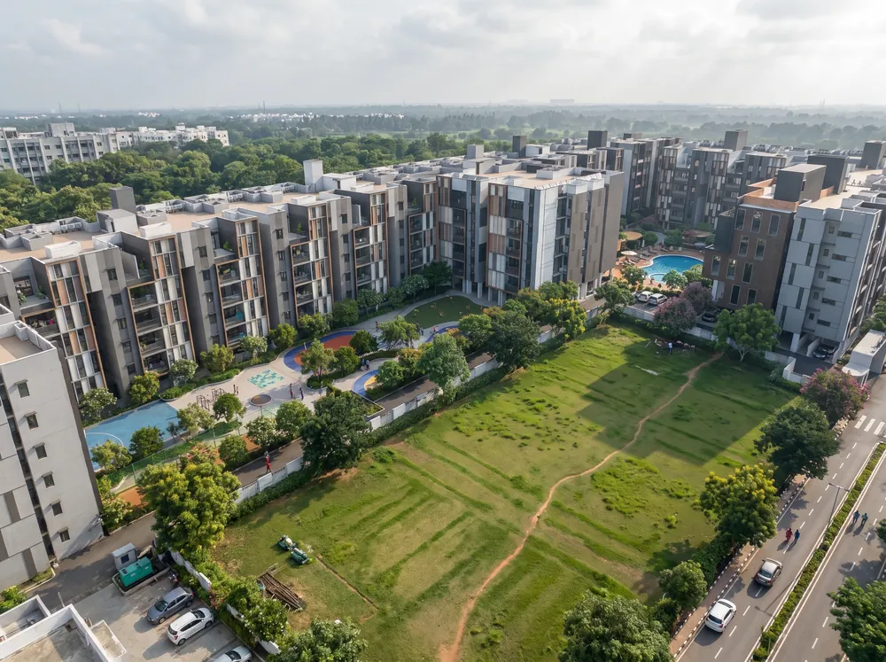 Low-rise blocks around a green grove — TVS Emerald Verde Vista (2 of 5)